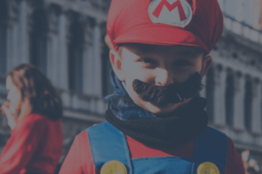 a little boy wearing Super Mario Costume